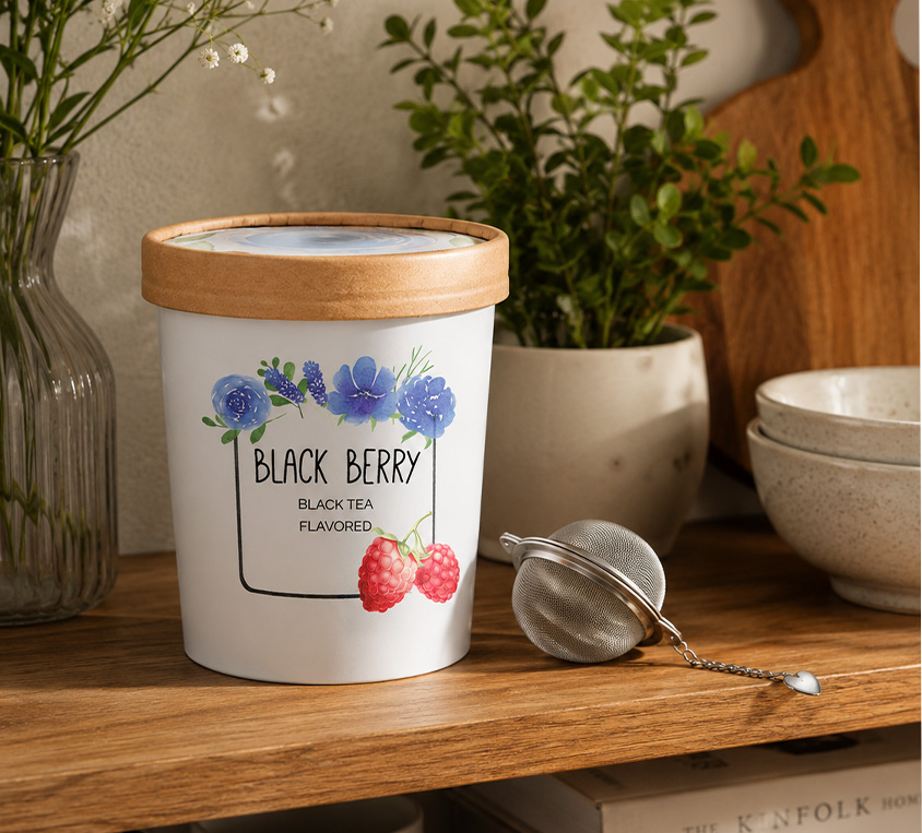 Raspberry Black Leo Tea w opakowaniu kubek tekturowy z przykrywka na upominek